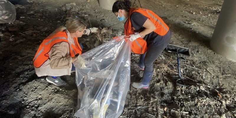 Women picking litter.